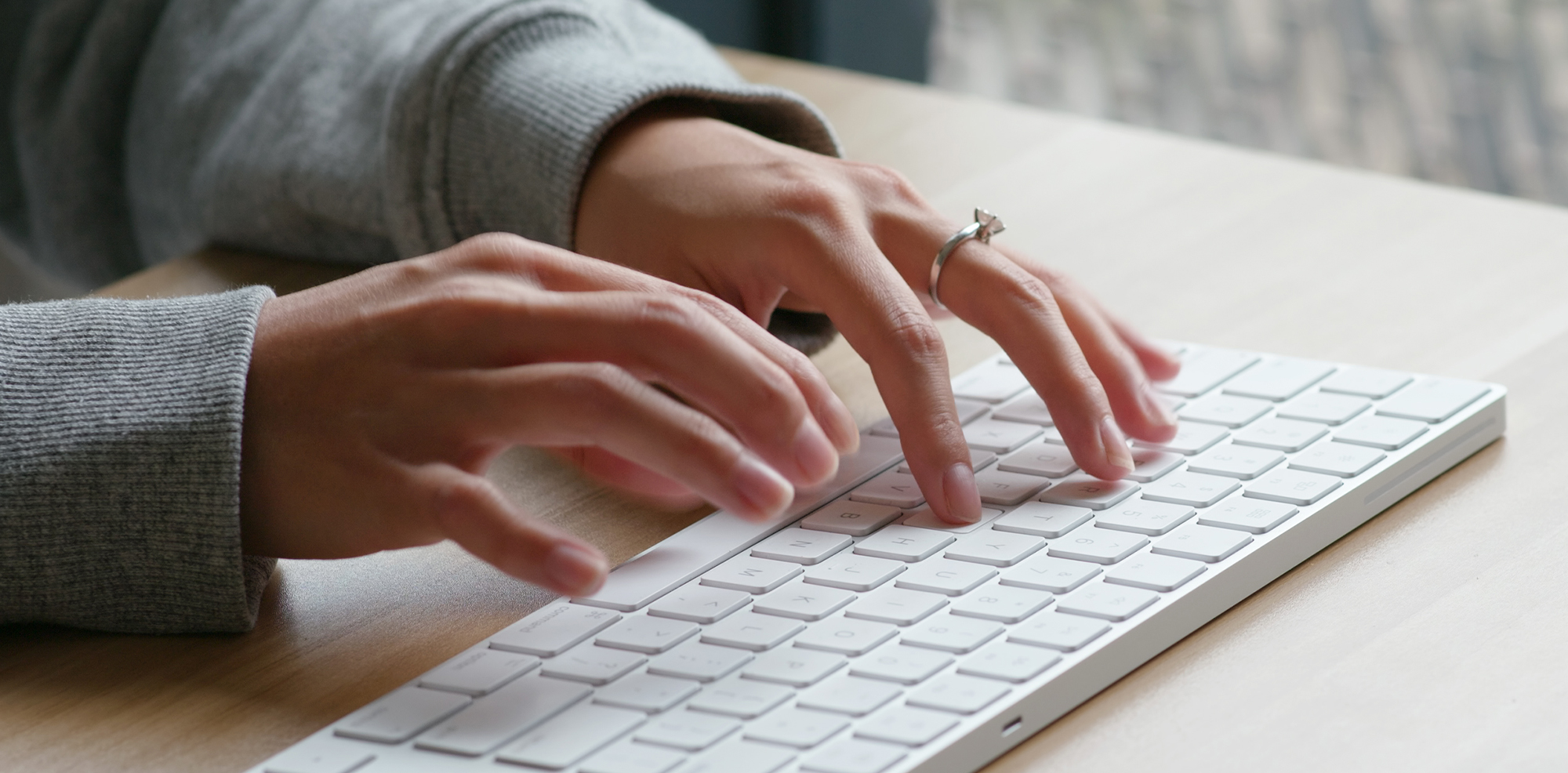 Woman typing for device software compliance