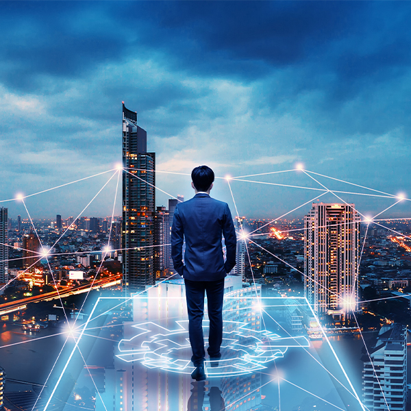 Man standing on Tech icon looking out to a city