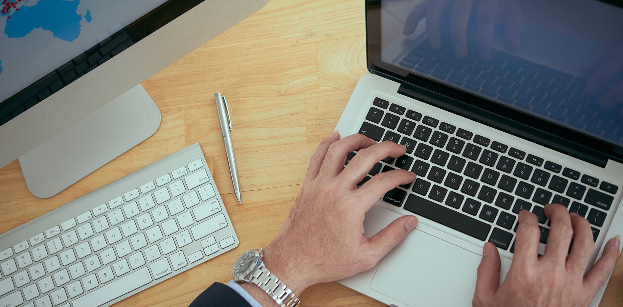 Man typing on laptop