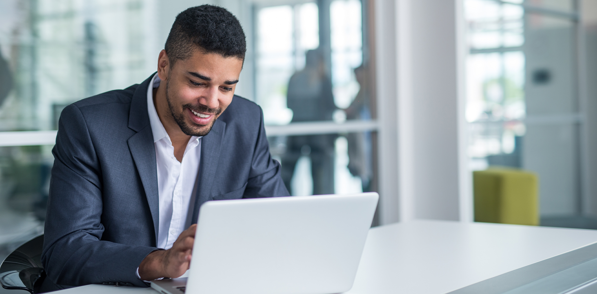 African American Man on Laptop at Work